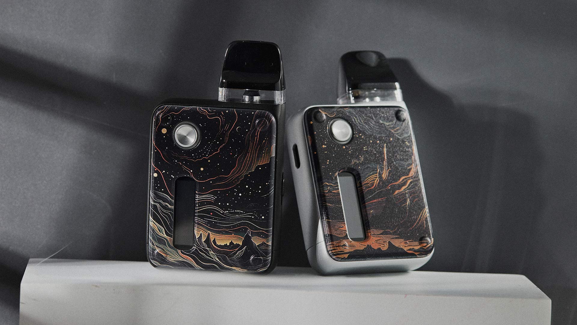 Innokin Endura V Box pod systems in two artistic designs, featuring intricate marbled patterns on a dark background.