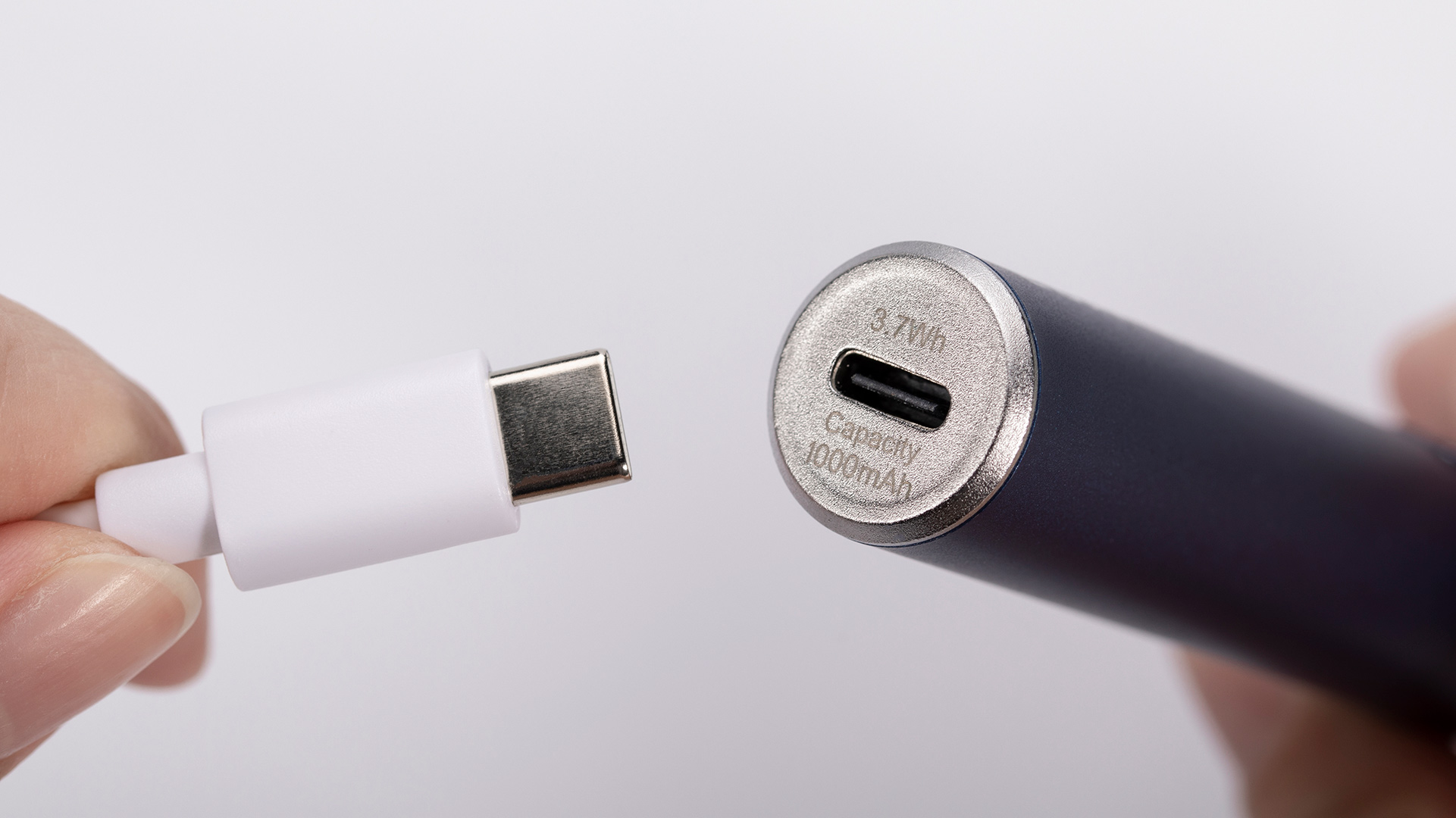 Connecting a USB cable to a vape pen, emphasizing proper charging techniques.