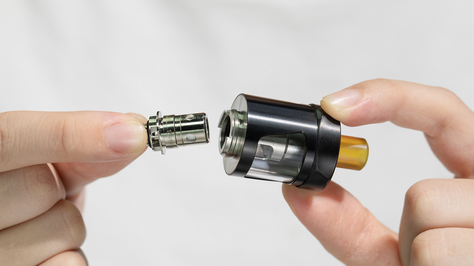 Vape tank and coil assembly, illustrating how components work together to produce vapor.