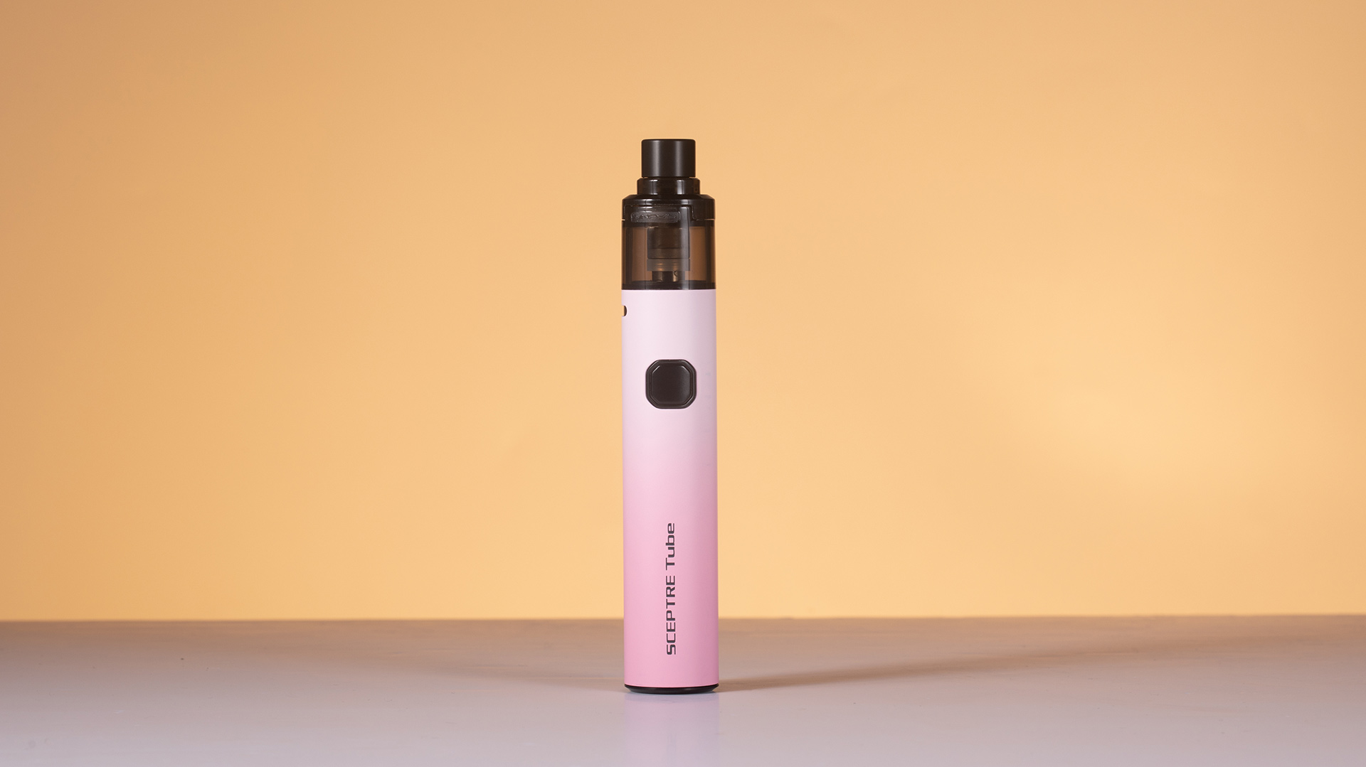 Vape pen standing upright, addressing charging issues with green light on.