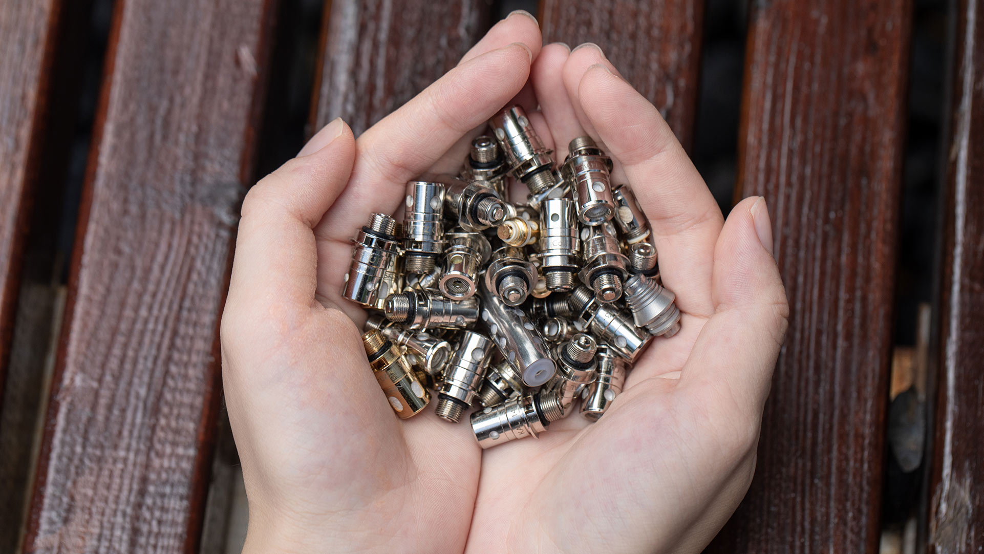 Extend vape coil life: use sugar-free e-liquid, prime coil, set correct wattage, and keep device dry. Image shows used coils, highlighting maintenance importance.