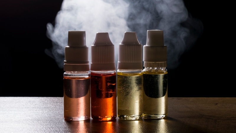 Old e-liquid bottles showing color changes that indicate expired vape juice.